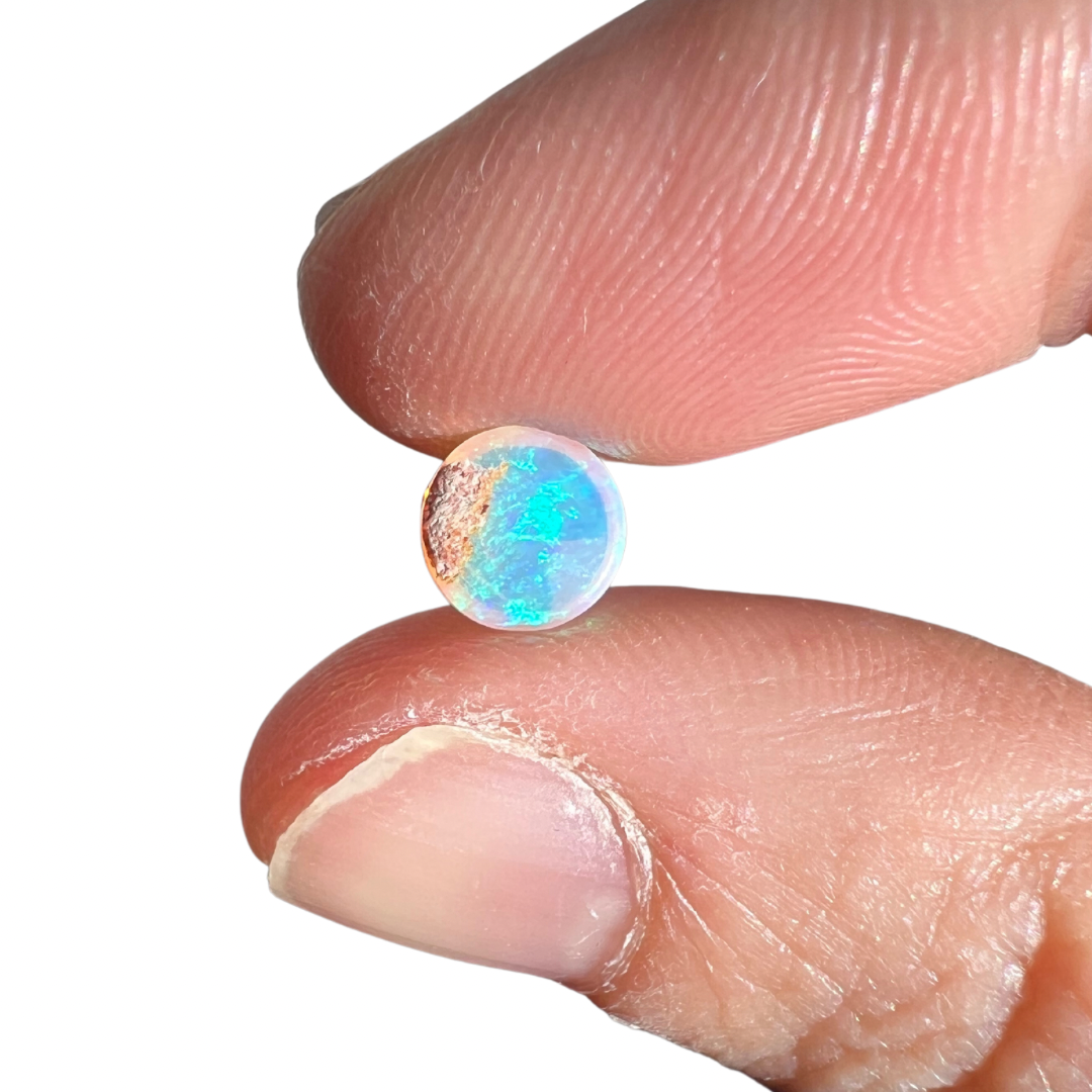 0.86 Ct round rainbow crystal opal