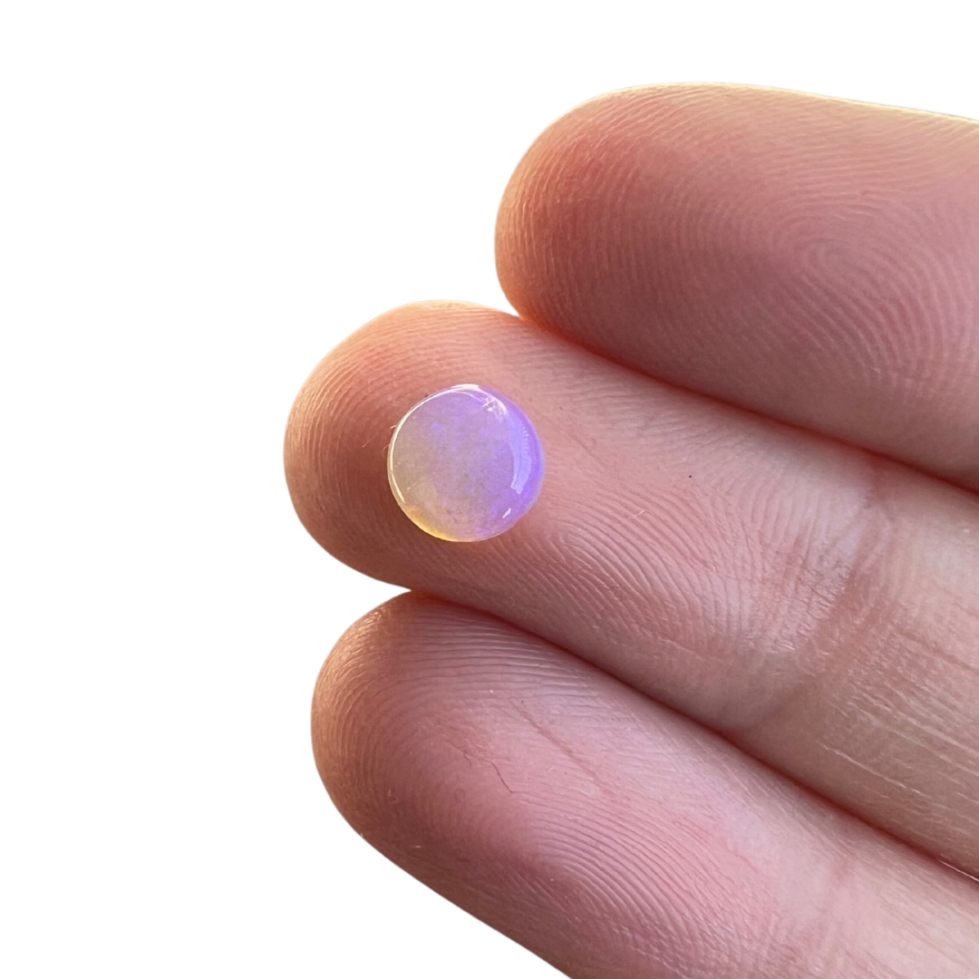 0.85 Ct round purple crystal opal