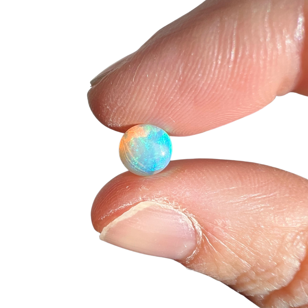 0.86 Ct round rainbow crystal opal