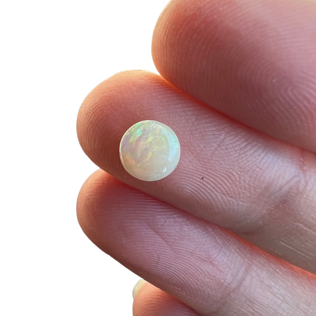 0.65 Ct round crystal opal