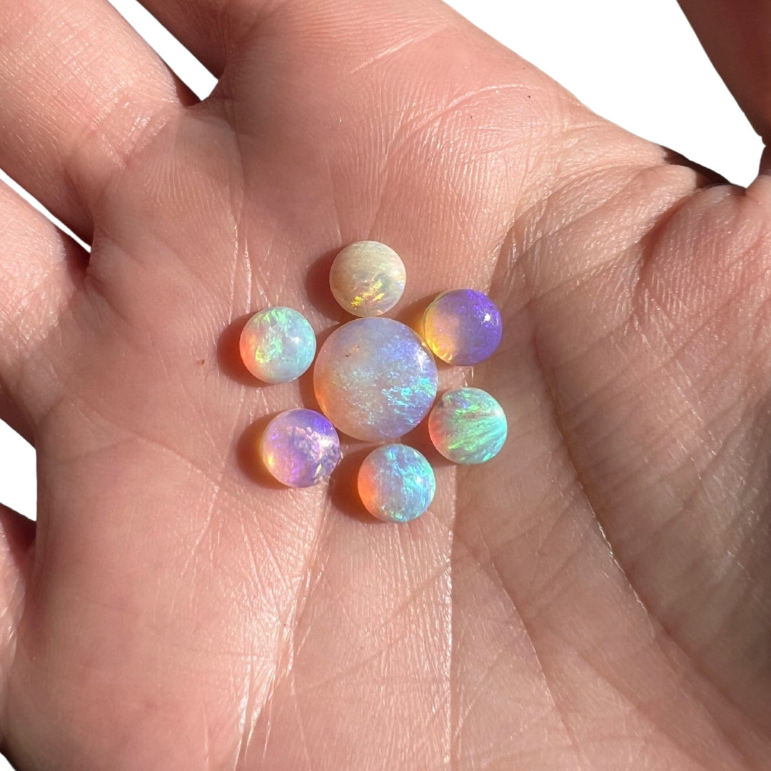 0.78 Ct round purple wood replacement opal
